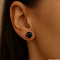 Earring worn on model’s ear to illustrate size and wear appearance