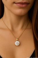Pendant worn on model to illustrate scale