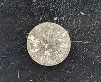 Close-up top view of loose round brilliant diamond on black background