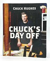 Front cover of the cookbook showing Chef Chuck Hughes posing with the book title prominently displayed.