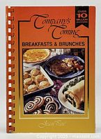 Front cover of the cookbook showing the title, author, and images of breakfast food dishes.