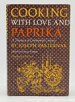 Front cover of the cookbook 'Cooking With Love and Paprika' with author Joseph Pasternak's name and decorative patterns.