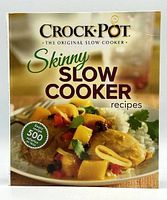 Front cover of the Crock Pot Skinny Slow Cooker Recipes cookbook showing dish image and branding.