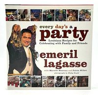 Front cover of the hardcover cookbook Every Day's A Party by Emeril Lagasse showing party theme and Mardi Gras beads.