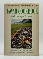 Front cover of the 1967 Hawaii Cookbook and Backyard Luau, showing the title, author, introduction credit, and a photo of a Hawaiian outdoor feast.