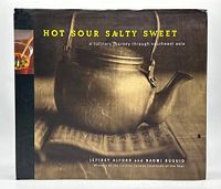 Front cover of the cookbook showing a large metal teapot in sepia tones with the title and author names.