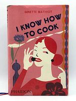 Front cover of the hardcover cookbook with colorful illustrated dust jacket showing a stylized woman on it.