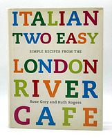 Front cover of the Italian Two Easy cookbook with colorful large text on white background.