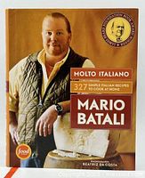 Front cover of the Molto Italiano cookbook showing Mario Batali, award emblem, and title with a food network logo.