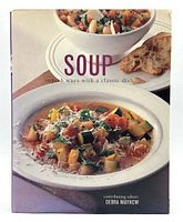 Front cover of the cookbook showing the title, photographic soup dishes, and contributing editor name.