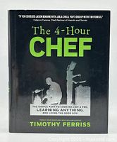 Front cover of The 4-Hour Chef hardcover book by Timothy Ferriss showing title and author with silhouette graphics.