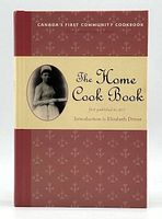 Front cover of The Home Cook Book featuring vintage photograph and title text.
