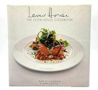 Front cover of The Lever House Cookbook showing a plated gourmet dish with crab claws and salad, title, and authors.