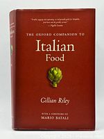 Front cover of The Oxford Companion to Italian Food showing title, author, and artichoke illustration.
