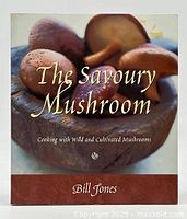 Front cover of 'The Savoury Mushroom' cookbook by Bill Jones showing a close-up image of mushrooms in a bowl.