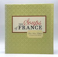 Front cover of 'The Soups of France' cookbook showing title and author with pale green patterned dust jacket.