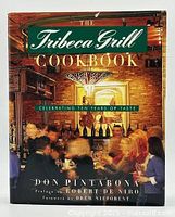 Front cover of The Tribeca Grill Cookbook showing the book title and dining scene.