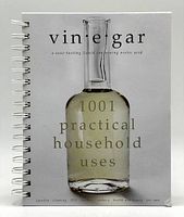 Front cover of book showing title and image of glass bottle with vinegar, spiral bound.