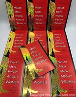 Ten copies of the book/notebook arranged standing and laid flat, showing front covers and spine titles.