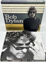 Front of slipcase and book cover showing titles and Bob Dylan images
