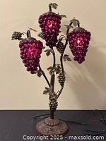 Full lamp illuminated, three grape cluster shades lit