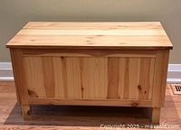 Front and top view of closed wooden chest