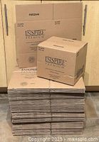 Stack of unassembled boxes with one assembled on top