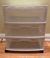 Front view of Sterilite three-drawer storage unit on wheels