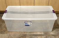 Front view of clear Sterilite bin with lid closed