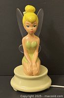 Front view of ceramic Tinker Bell light on round base with power cord