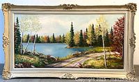 Front view of framed autumn landscape painting