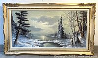 Full view of framed winter landscape painting
