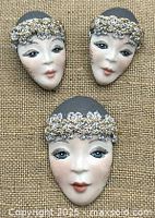 Brooch and earrings front view on burlap background