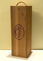 Front view of wood storage box with Willow Heights logo and rope handle