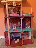 Full view of Barbie dollhouse showing all three floors and some accessories