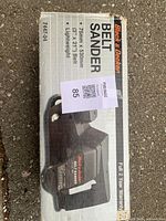 Box for Black & Decker belt sander labeled 3x21 Belt, lightweight, full 2 year warranty