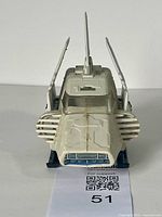 Front view of the off-white Imperial Shuttle Pod toy with flapping wings open.