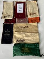 Top view showing all 10 pipe sacks/bags with various brands and colors