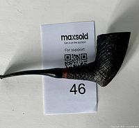 Side view of a vintage Navigator tobacco pipe showing the rusticated textured bowl and curved black stem.