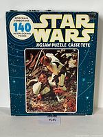 Front of puzzle box showing full Star Wars branding and trash compactor image.
