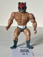 Front view of the vintage Masters of the Universe Zodac action figure showing sculpted chest hair, boots, briefs, helmet details.