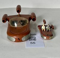 Top front view of the Land Speeder with the smaller speeder and two figures included showing condition of plastic and windshield
