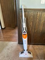 Front view of the Bissell PowerFresh steam mop showing the handle, control panel, and triangular base.