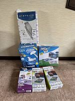 Entire lot of ironing board cover and pad, fabric steamer, space bags, and smart bags as packaged