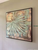 Photo showing the framed wall art hung on a neutral wall, capturing the full artwork and frame.