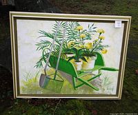 Full front view of the framed painting showing the garden scene with wheelbarrow, plants, flowers, and tools.