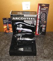 Arcosteel corkscrew, box, wine stopper, wind resistant lighter arranged for sale photo