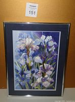 Front image showing the full framed watercolour painting of irises with mat and silver frame.