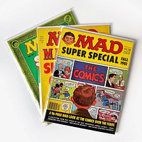 Photo showing three vintage MAD magazines in bags and boards, fanned out showing covers including Fall 1981 Super Special.