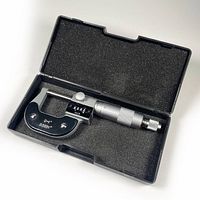 Micrometer in black protective case lined with foam, showing the entire tool and case interior.